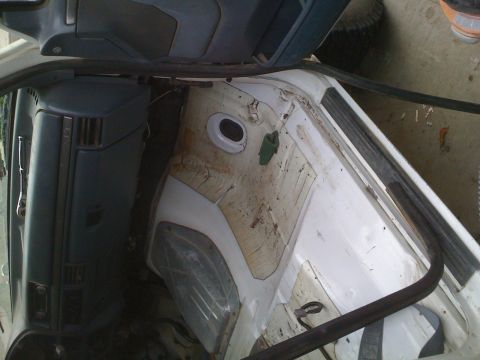 1992 Ford Bronco - The rear cargo area and dashboard of a white vehicle are visible in this interior shot.