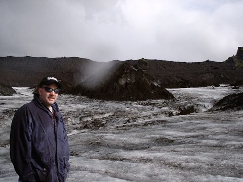 1996 Ford Bronco - A man poses for a photo on a vast, icy landscape under a cloudy sky.