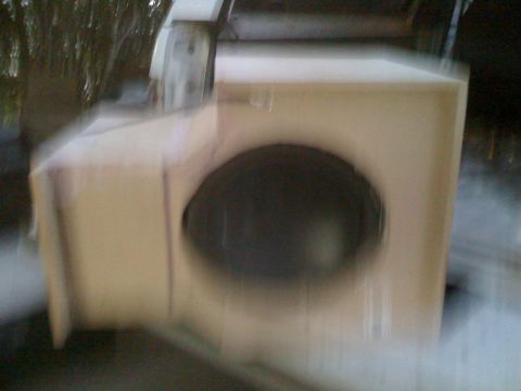 1992 Ford Bronco - A speaker box with a visible speaker is shown in this image.