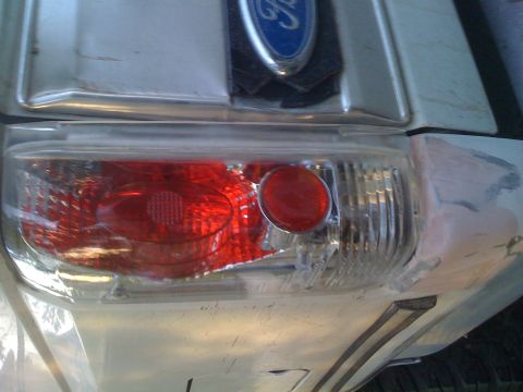 1992 Ford Bronco - Close-up of a 1992 Ford Bronco's rear taillight and Ford emblem.