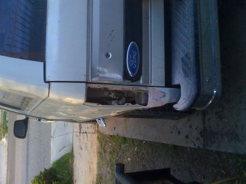 1992 Ford Bronco - This photo shows the rear quarter panel of a Ford Bronco, with a visible Ford emblem.