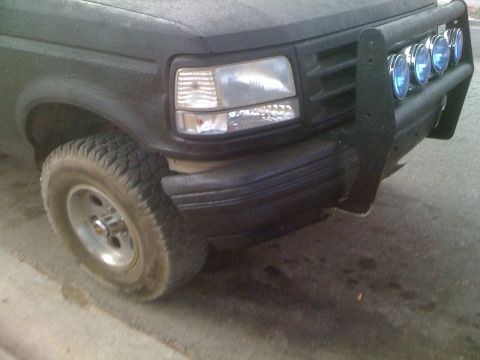 1992 Ford Bronco - Front view of a 1992 Ford Bronco with an aftermarket bumper and auxiliary lights.