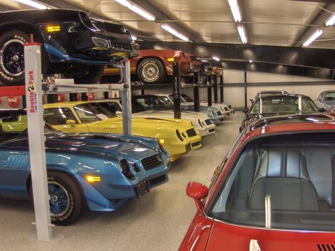 1979 Chevrolet Camaro - Multiple generations of Chevrolet Camaros are stored in a multi-level garage.