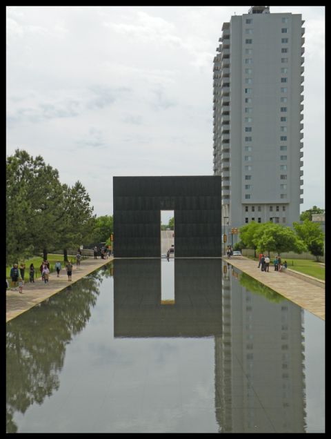 1998 Subaru Legacy - The Oklahoma City National Memorial features a reflecting pool and a large building in the background.