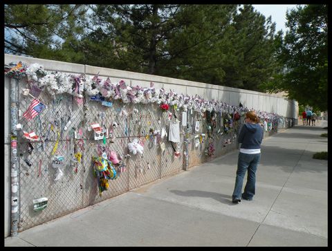 1998 Subaru Legacy - The Oklahoma City Memorial wall, adorned with numerous tributes, draws visitors to reflect.