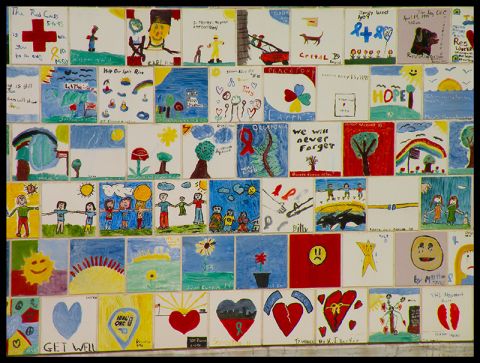 1998 Subaru Legacy - A collection of ceramic tiles features various drawings, many with messages of hope and remembrance.