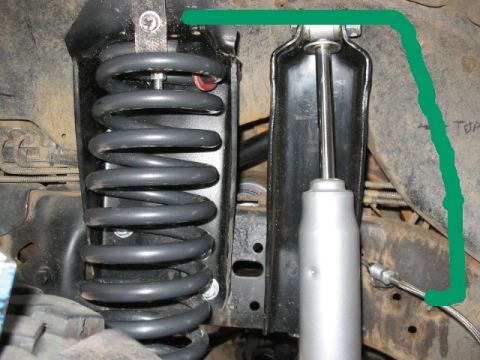 1995 Ford Bronco - Close-up view of the front suspension system, highlighting the coil springs and shock absorbers.