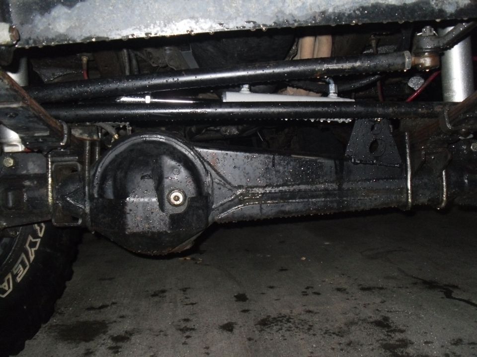 Undercarriage of a vehicle, showing the rear differential and suspension components