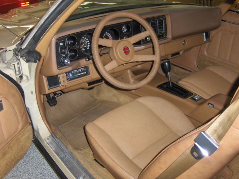 1979 Chevrolet Camaro - Interior view of a 1979 Chevrolet Camaro, its tan upholstery and dashboard details.