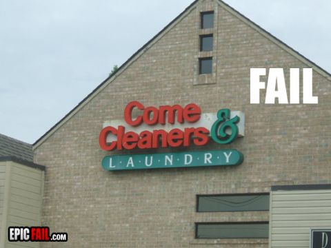 2000 Mercury Grand Marquis - A building sign for a dry cleaner and laundry service is humorously overlaid with the word "FAIL".