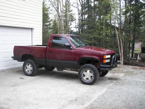 1990 Chevrolet Suburban - This pickup truck appears to be from the mid-1990s, likely a Chevrolet C/K model.