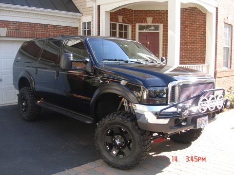 2000 Ford Excursion - Modified 2000 Ford Excursion SUV with custom grille guard and auxiliary lights.