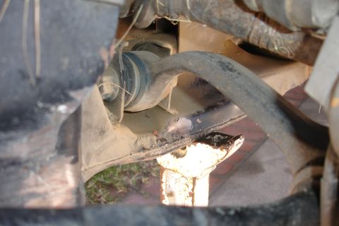 1992 Ford Taurus - Undercarriage view of suspension and subframe components, possibly during a repair or inspection.