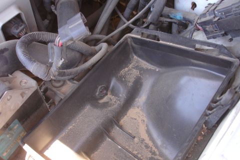 1992 Ford Taurus - Engine bay components, including wiring and an air intake box, are visible in this close-up view.
