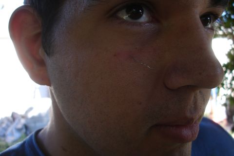 1992 Ford Taurus - A close-up profile view of a man's face, with details of his skin texture and facial features visible.