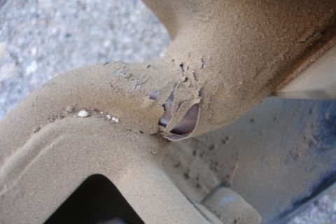 1992 Ford Taurus - Corroded metal tubing shows significant rust and damage, indicating wear or structural compromise.