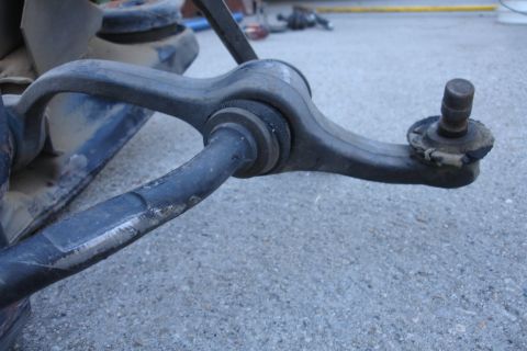 1992 Ford Taurus - Front suspension control arm and ball joint assembly, likely from a car or truck.