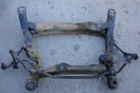1992 Ford Taurus - This is a front subframe assembly, likely removed from a vehicle for repair or replacement.