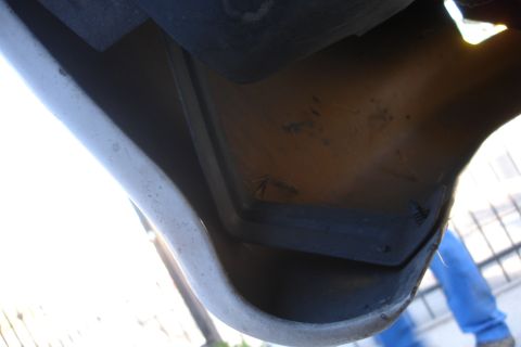 1992 Ford Taurus - Undercarriage view of a vehicle, focusing on the bumper and frame area.