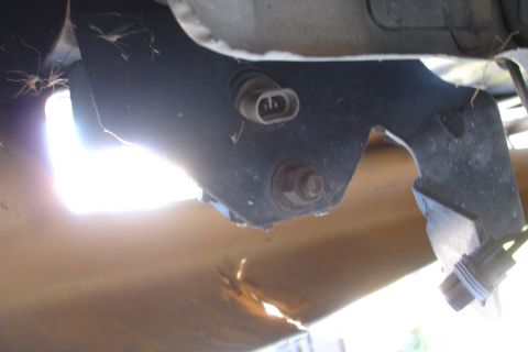 1992 Ford Taurus - A close-up view of a vehicle's subframe bracket, showing signs of wear and tear.