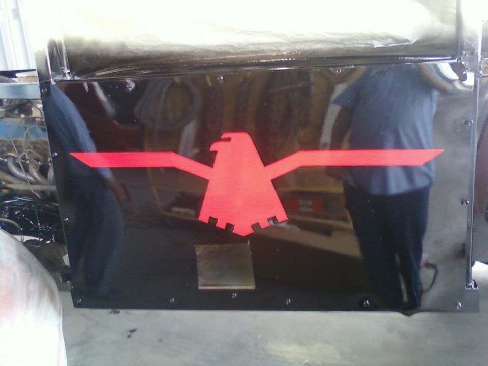 Black panel with red eagle emblem and 'SUPERMOTORS' text