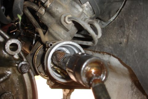 1992 Ford Taurus - Close-up view of a steering rack and pinion assembly, likely undergoing repair or inspection.