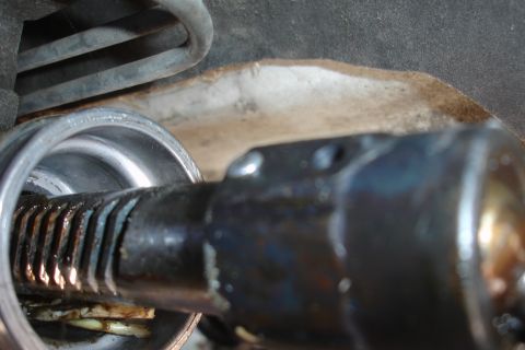 1992 Ford Taurus - Close-up view of a steering rack and pinion assembly, highlighting the splined shaft and surrounding components.