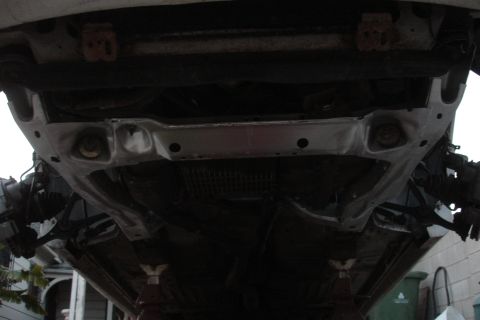 1992 Ford Taurus - The underside of a vehicle's subframe is shown, indicating a potential repair or replacement.