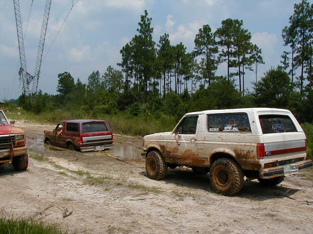 1990 Ford Bronco in mud, rear view