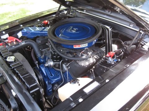 1968 Shelby GT500 - The engine bay of a 1968 Shelby GT500, a prominent blue air cleaner and matching valve covers.