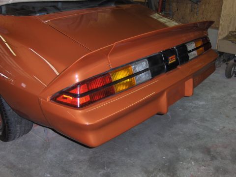 1980 Chevrolet Camaro - Rear view of an orange 1980 Chevrolet Camaro showing the spoiler and Z28 badging.