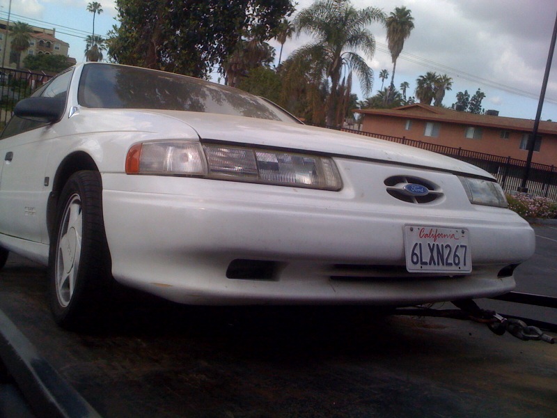 Front view of a white 1992 Ford Taurus with a California license plate