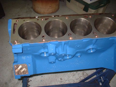 1969 Ford Torino - Engine block with four cylinders, painted bright blue.