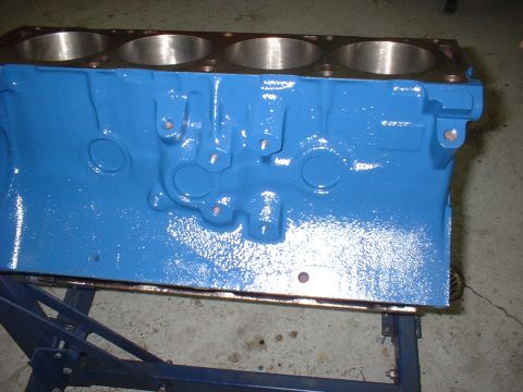 1969 Ford Torino - A blue painted engine block is shown from the side, with cylinder bores visible at the top.