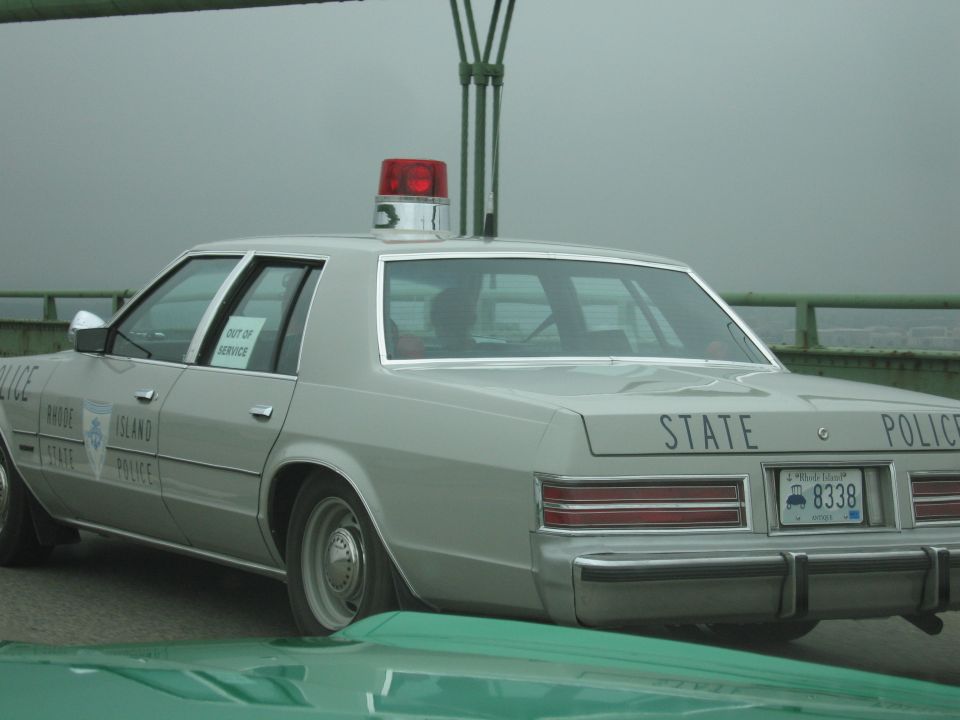 Rhode Island State Police out-of-service sedan on a foggy bridge
