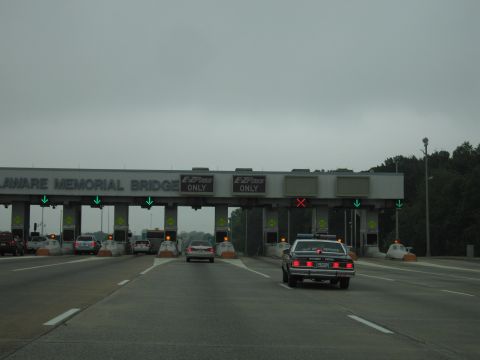 1991 Ford Crown Victoria - A police car approaches the toll booths at the Delaware Memorial Bridge.