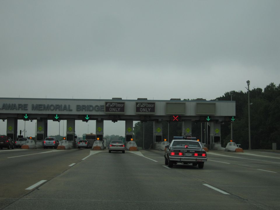 Police cruiser approaching the Delaware Memorial Bridge toll plaza