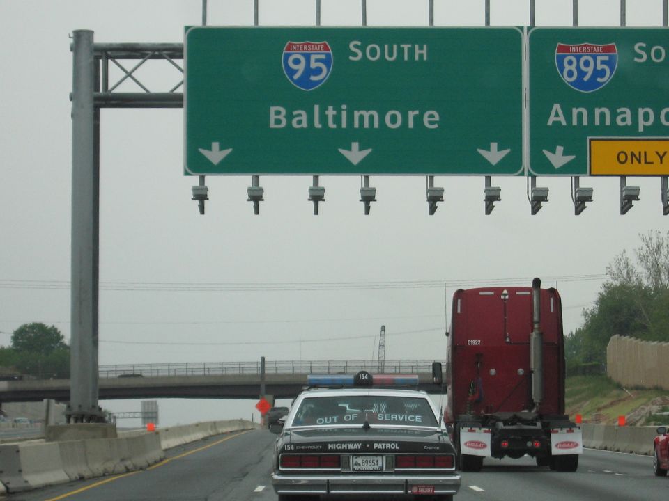 Highway overhead signs for I-95 Baltimore and I-895 Annapolis above traffic