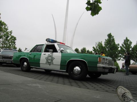 1991 Ford Crown Victoria - This 1991 Ford Crown Victoria is marked as a sheriff's vehicle and is parked near a monument.