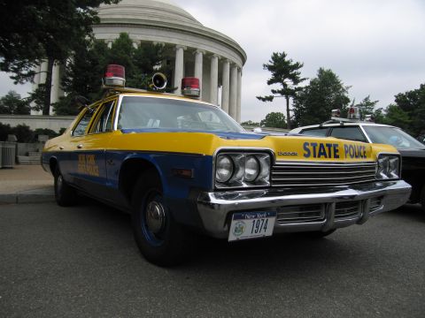 1991 Ford Crown Victoria - A vintage New York State Police car is parked in front of a domed building, with another police car visible behind it.