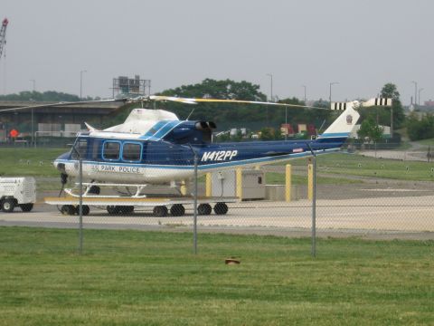 1991 Ford Crown Victoria - A US Park Police helicopter is parked on a trailer at an airfield.