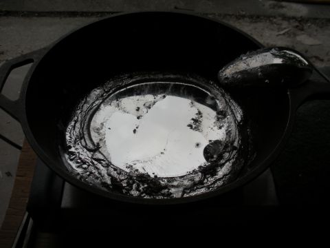 1996 Ford Bronco - Molten metal is being prepared in a cast iron pot, possibly for casting.