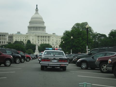 1991 Ford Crown Victoria - Police car parked in lot with US Capitol Building visible in the background.