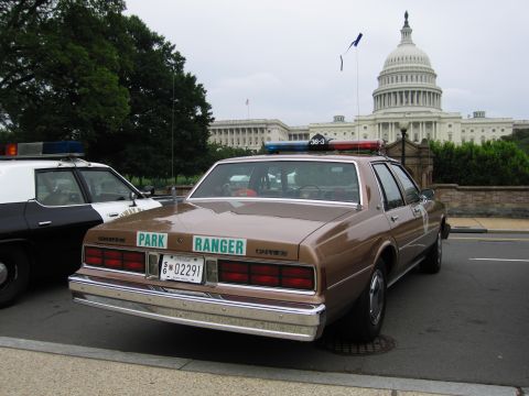 1991 Ford Crown Victoria - A park ranger vehicle is parked in front of the Capitol building.