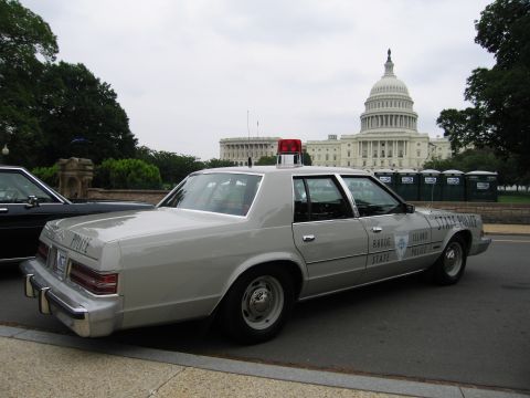 1991 Ford Crown Victoria - A Rhode Island State Police car is parked in front of the US Capitol building.