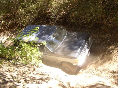 1989 Ford Bronco - This Ford Bronco appears to be from the late 1980s, not 1989, as it navigates rough terrain.