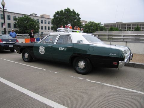 1991 Ford Crown Victoria - This police car, marked "68 PCT" and "1745", is a 1970 model, not a 1991 Ford Crown Victoria.