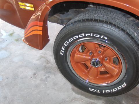 1980 Chevrolet Camaro - Close-up of a 1980 Chevrolet Camaro's front fender and wheel, orange stripes and BFGoodrich tires.