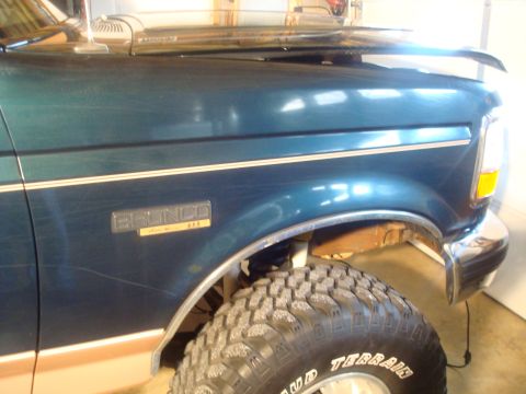 1995 Ford Bronco - The fender badge and body style indicate this is a Ford Bronco, likely from the early to mid-1990s.