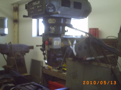 1993 Ford Taurus - A workshop scene a milling machine and other industrial equipment.